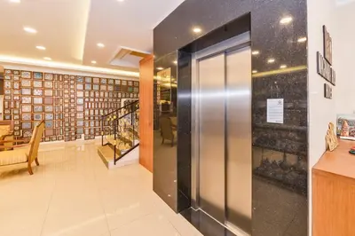 a hallway with a large glass door in a library at Magnaura House Hotel in Istanbul