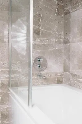 a shower with a glass door in a bathroom at City Center Hotel Taksim İstanbul in Istanbul