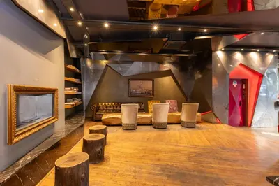 a room with stools and a couch and a tv at Tulip City Hotel & Spa in Istanbul