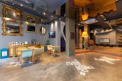 a room with a salon with a table and chairs at Tulip City Hotel & Spa in Istanbul