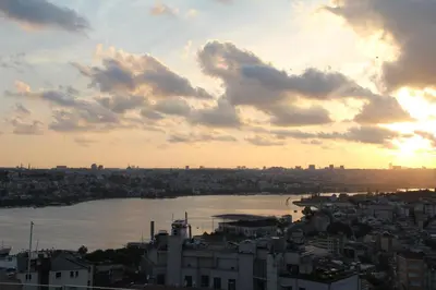 a view of a city and a river at sunset at Tulip City Hotel & Spa in Istanbul