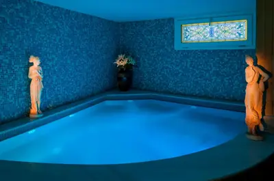 two statues in a room with blue lights at Hotel Buyuk Keban in Istanbul