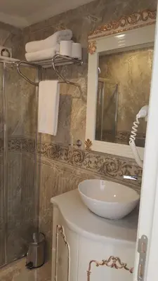 a bathroom with a sink and a mirror at Best Town Hotel in Istanbul