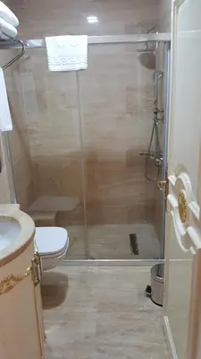 a bathroom with a shower and a toilet at Best Town Hotel in Istanbul