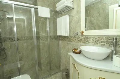 a bathroom with a shower and a sink at Best Town Hotel in Istanbul