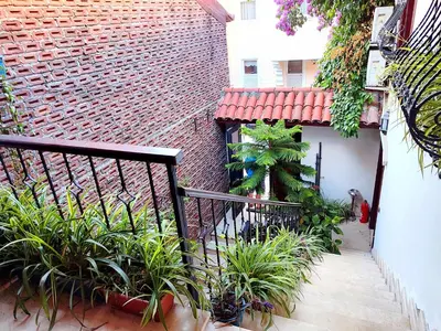 a balcony with plants and a brick building at Villa Sphendone Suites Istanbul in Istanbul