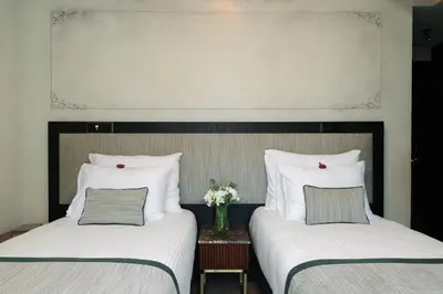 two beds sitting next to each other in a room at Tria Elegance Istanbul in Istanbul