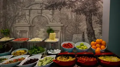a buffet with many bowls of different types of food at Raymond Hotel Old City in Istanbul