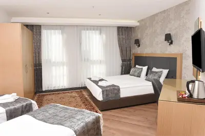 a hotel room with two beds and a television at Gulec Hotel & Spa - Special Category in Istanbul
