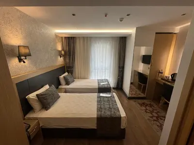 a hotel room with two beds and a television at Gulec Hotel & Spa - Special Category in Istanbul