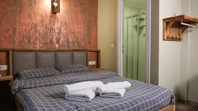 a bedroom with a bed with towels on it at Second Home Hostel in Istanbul