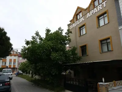 a building with a sign on the side of it at Bandirma Saglik Apart in Bandırma