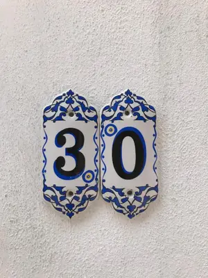 a blue and white object with a number on a wall at Catirga Konak Apartments in Istanbul