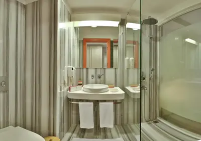 a bathroom with a sink and a shower at Senatus Hotel - Special Class in Istanbul