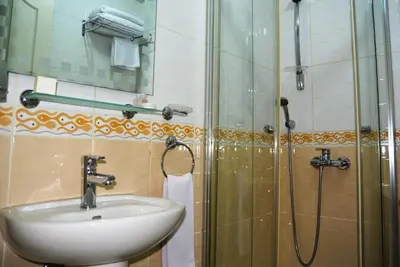 a bathroom with a sink and a shower at May Hotel Istanbul in Istanbul