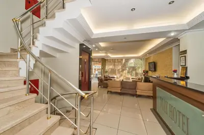 a staircase in a home with a living room at May Hotel Istanbul in Istanbul