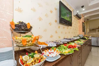 a buffet line with many plates of food at May Hotel Istanbul in Istanbul