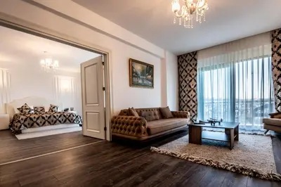 a living room with a couch and a table at Heybeli Hotel in Mudanya