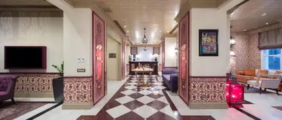 a hallway of a hotel with a living room at Hagia Sofia Mansions Istanbul, Curio Collection by Hilton in Istanbul