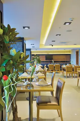 a dining room with a table and chairs in a restaurant at İstanbul Trend Hotel Old City in Istanbul