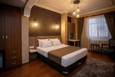 a hotel room with a large bed in a room at Hotel Pera Capitol - Taksim & İstiklal in Istanbul