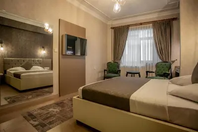 a hotel room with a bed and a tv at Hotel Pera Capitol - Taksim & İstiklal in Istanbul