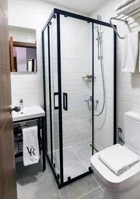 a bathroom with a shower and a toilet and a sink at Cheers Vera Edition Hotel in Istanbul