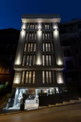a tall building with lights on it at night at Endless Art Hotel-Special Category in Istanbul