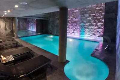 a pool in a building with a lit up wall at Endless Art Hotel-Special Category in Istanbul