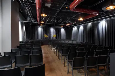 an empty room with chairs and black curtains at Endless Art Hotel-Special Category in Istanbul