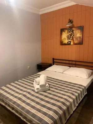 a bedroom with a bed with a towel on it at Volare Apart in Istanbul