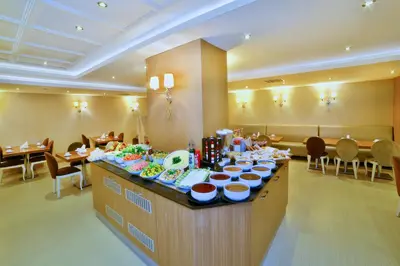 a buffet in a restaurant with plates of food at Hotel Grand Emin in Istanbul