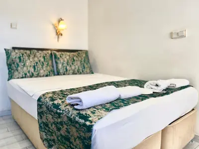 a hotel room with two beds with towels on them at Magnificent Hotel in Istanbul