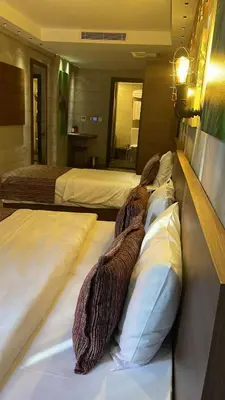 a bedroom with two beds with pillows and blankets at Elibol Hotel Old City in Istanbul