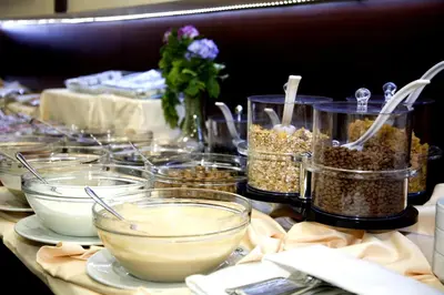 a table topped with bowls of food and other ingrediants at Gülhanepark Hotel & Spa in Istanbul