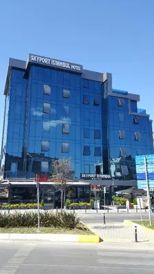 a blue building with a bus in front of it at Skyport Istanbul in Istanbul