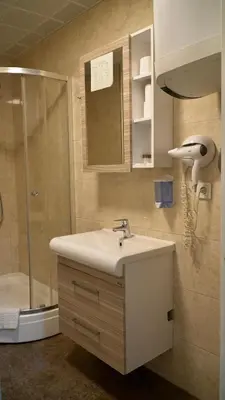 a bathroom with a sink and a shower at Skyport Istanbul in Istanbul