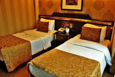 a hotel room with two beds and a phone at Sultanahmet Park Hotel in Istanbul