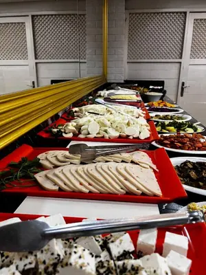 a buffet with many different types of food on trays at Seher HOTEL in Istanbul
