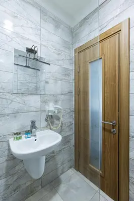 a bathroom with a sink and a glass shower at Seher HOTEL in Istanbul
