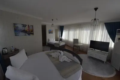a hotel room with a bed and a television at Omega Luxx Hotel in Istanbul
