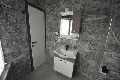 a bathroom with a sink and a mirror at Omega Luxx Hotel in Istanbul