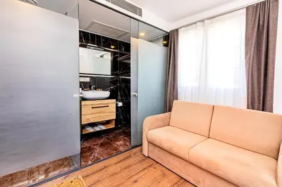 a living room with a couch and a sink at Neda in Istanbul