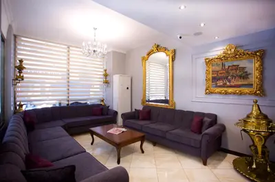 a living room with two couches and a table at Grand Ant Hotel in Istanbul