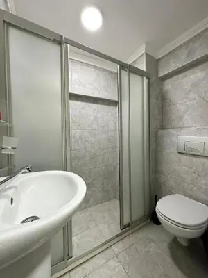 a bathroom with a white sink and a toilet at Antik Ipek Hotel in Istanbul