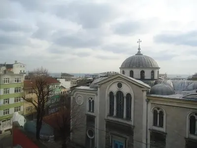a church with a cross on the top of it at Antik Ipek Hotel in Istanbul