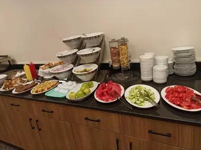 a buffet with plates of food on a table at Fatih Resadiye Hotel in Istanbul