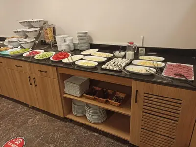 a buffet with many plates of food on a table at Fatih Resadiye Hotel in Istanbul