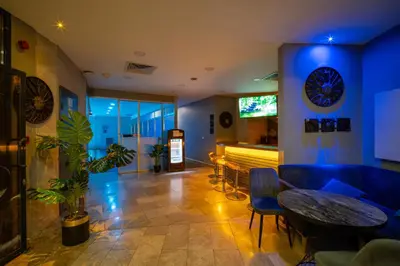 a room with a bar with a table and chairs at Grand S Hotel in Istanbul