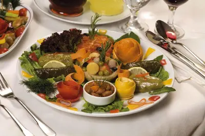 a white plate of food on a table at Dila Hotel in Istanbul
